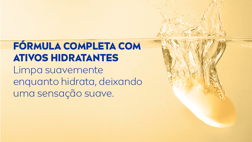 Fórmula completa com ativos hidratantes Limpa suavemente enquanto hidrata, deixando uma sensação suave. Fundo amarelo. À direita, há uma barra de sabonete sendo mergulhada na água, criando respingos e movimento no líquido.