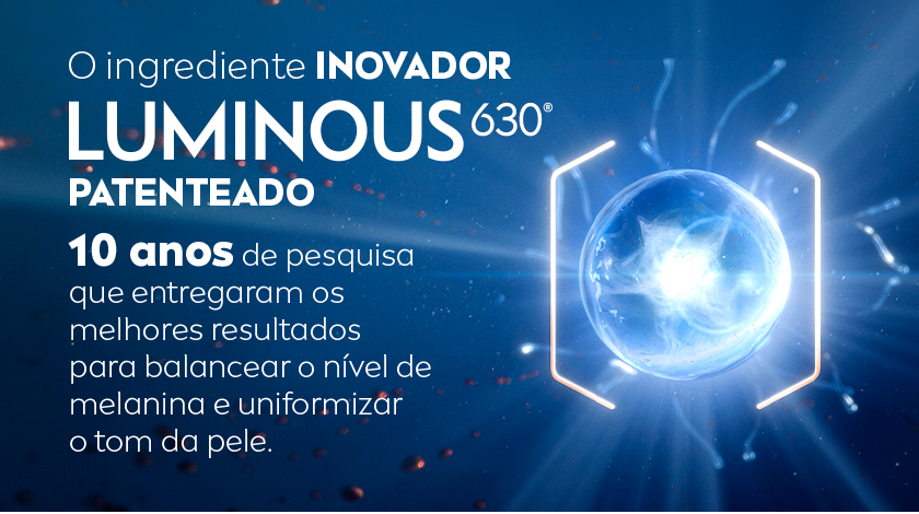 Fundo azul escuro com efeito de energia e partículas brilhantes. Ao centro, uma esfera luminosa simboliza o ingrediente Luminous630° patenteado.