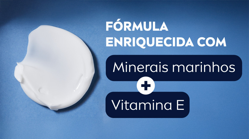 Textura de um creme branco em destaque. O fundo é azul escuro.