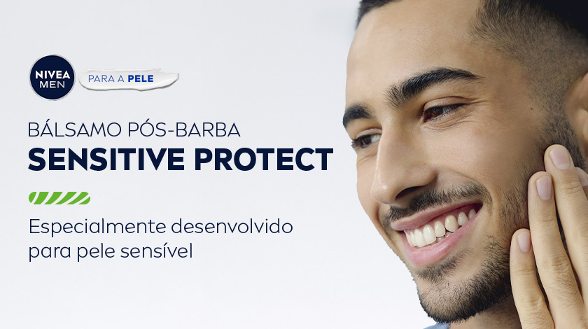 Homem sorridente passando a mão no rosto. O fundo é cinza claro, e ao canto superior esquerdo é apresentado o logo de NIVEA men para a pele.