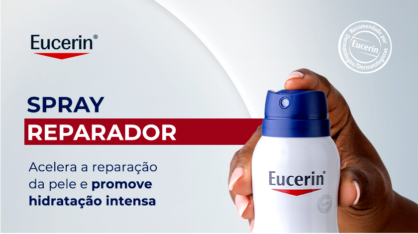Close-up de uma mão segurando o frasco de Eucerin Aquaphor Spray Reparador. À esquerda, os textos 