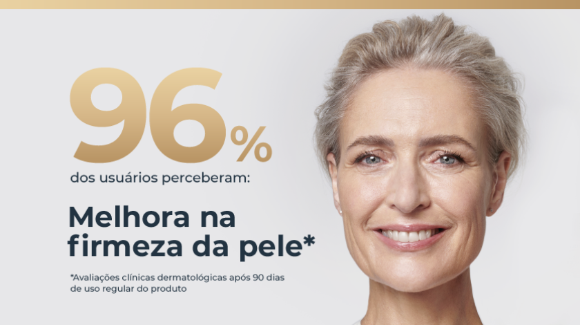 Mulher de pele clara e cabelos grisalhos curtos, sorrindo suavemente de frente.