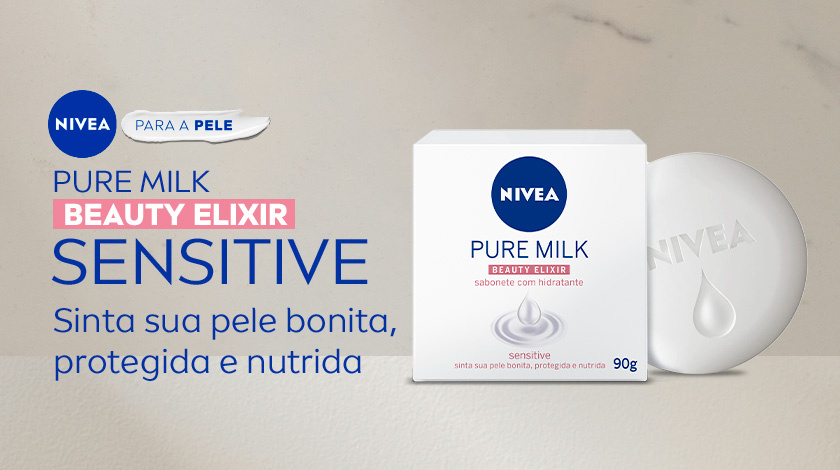 PURE MILK BEAUTY ELIXIR SENSITIVE Sinta sua pele bonita, protegida e nutrida Imagem de um sabonete em barra NIVEA Pure Milk Beauty Elixir Sensitive ao lado de sua embalagem sobre superfície clara. Sua embalagem é branca, com detalhes em rosa.