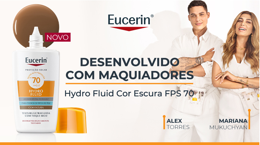 Frasco do Eucerin Hydro Fluid Cor Escura FPS 70 está ao lado esquerdo, ao lado direito estão dois maquiadores sorrindo em pé. O fundo é claro, com detalhes em laranja.