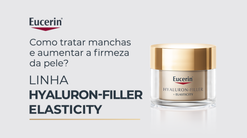 Pote de creme facial Eucerin branco com tampa dourada, em fundo cinza claro.