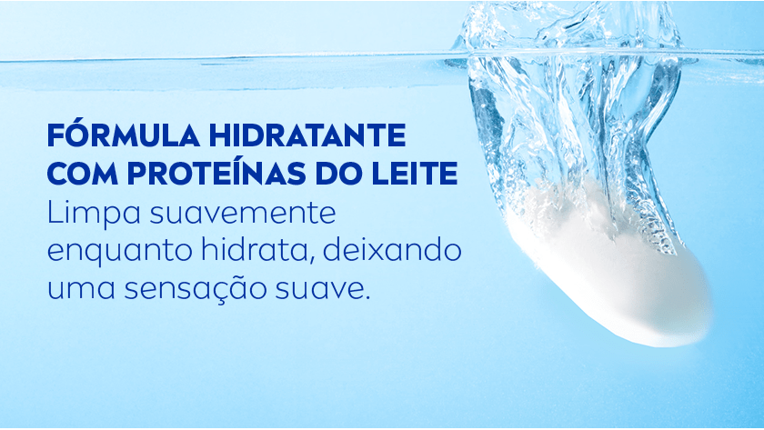 Sabonete sendo mergulhado na água com destaque para a fórmula hidratante. O fundo é azul.