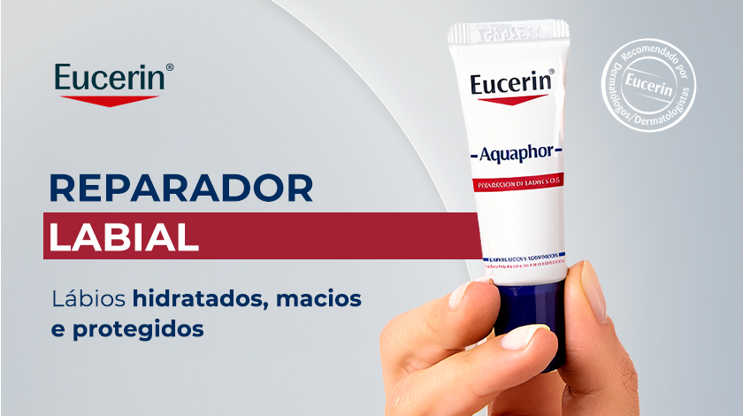 Uma mão segura o tubo de Eucerin Aquaphor Reparador Labial. Ao lado, o texto em destaque 