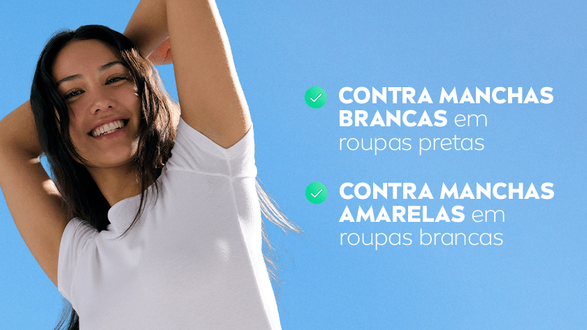 Mulher sorridente de cabelos longos e escuros levanta os braços, usando uma camiseta branca, em frente a um céu azul claro. À direita da imagem, há dois ícones de check verdes acompanhados de texto que destaca benefícios do produto.