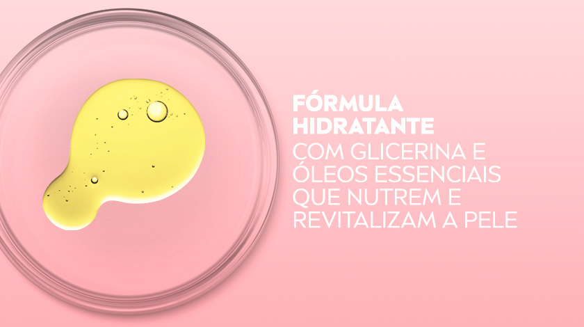 Prato de vidro transparente com óleo amarelo em formato orgânico sobre fundo rosa claro.