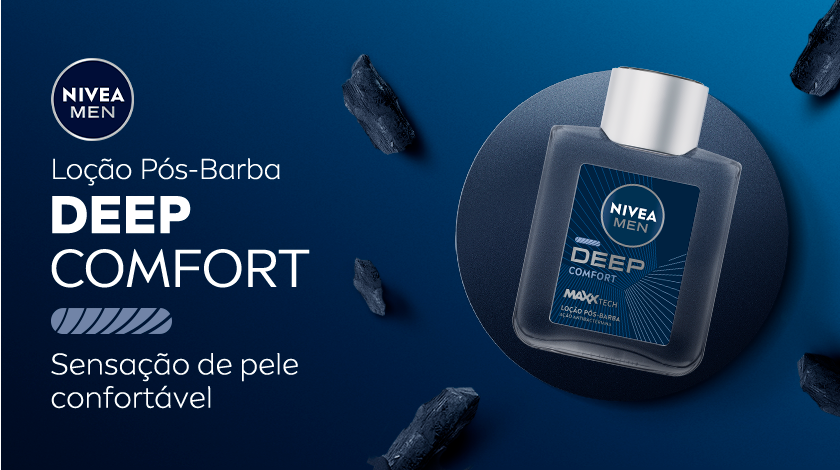Imagem da loção pós-barba NIVEA MEN DEEP COMFORT sobre fundo azul, rodeada por pedras de carvão. Texto em destaque ao lado do frasco.