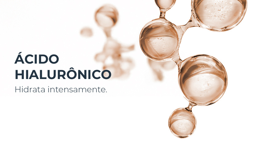 Imagem em fundo claro com estruturas esféricas translúcidas em tom âmbar, representando moléculas de ácido hialurônico.