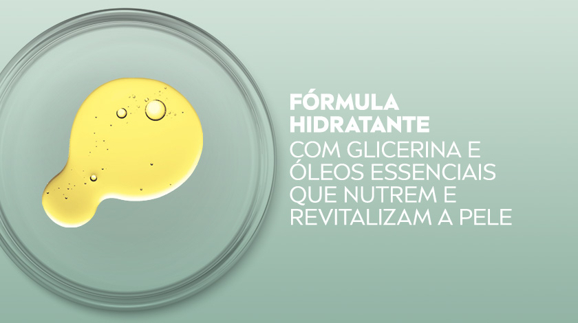 Imagem de um prato de vidro transparente com óleo amarelo em formato orgânico sobre fundo verde claro.